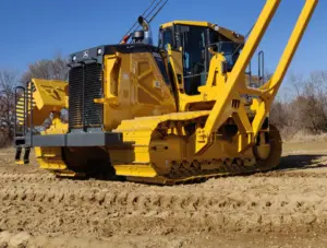 John Deere 850L PL100 pipelayer with wide tracks distributing weight for low ground pressure on a pipeline right-of-way